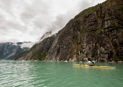 tracy arm yellow kayak cliffs